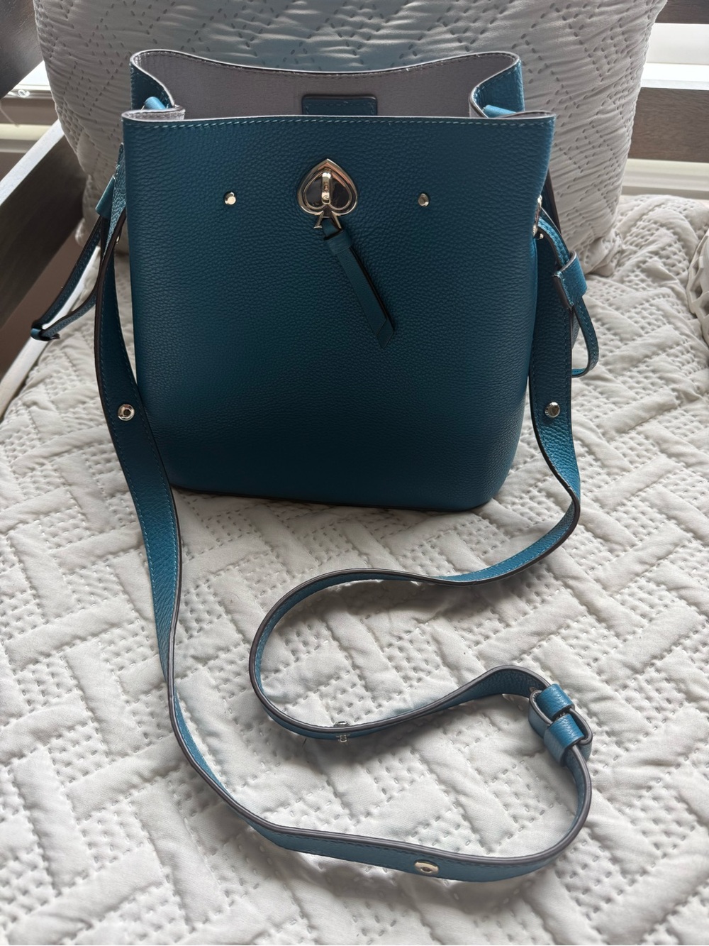 kate spade teal pebbled leather bucket crossbody with gold spade charm
